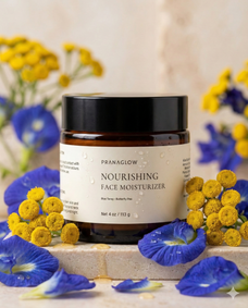 Pranaglow nourishing face moisturizer jar with flowers in the background