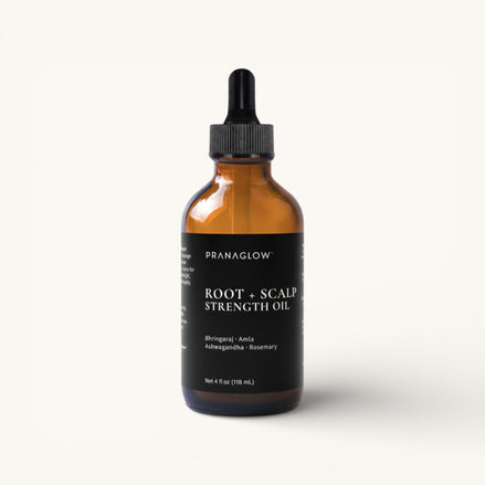 Pranaglow Root + Scalp Strength Oil bottle on a white background
